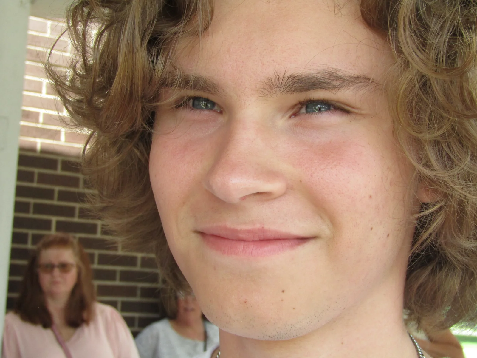 A calm portrait of a teenager supported through grief counseling