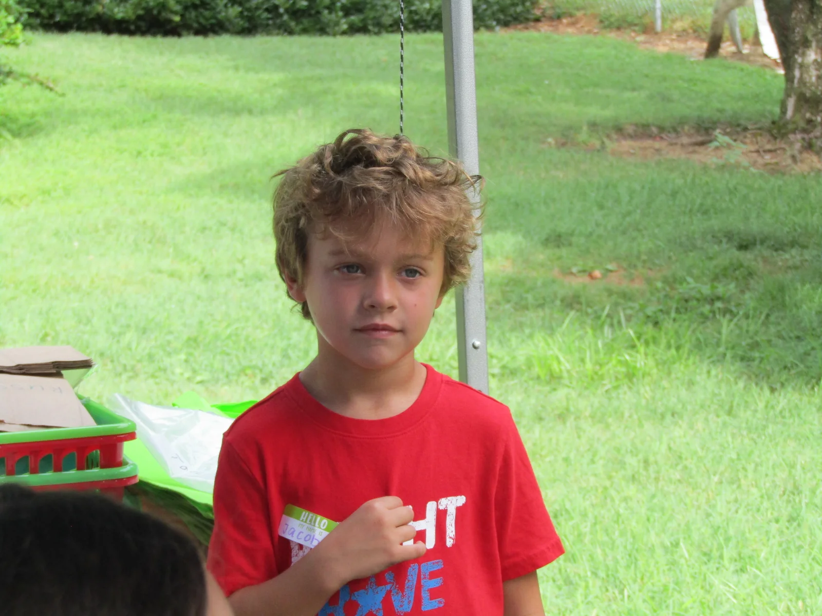 Children spending time together outdoors at a support program